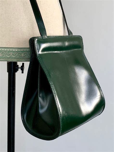 dark green leather crossbody bag.